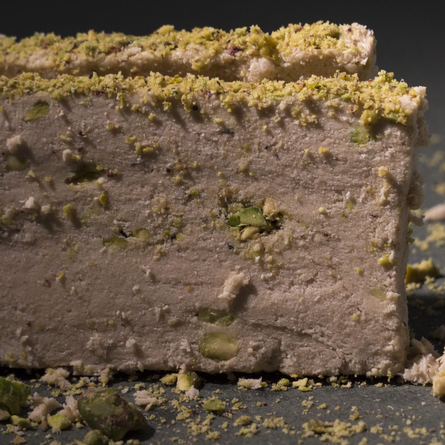 Golden pistachio chunks and nigella seed accents shine