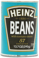 Heinz Beans in Tomato Sauce cans stacked on a shelf, fiber-rich and versatile.