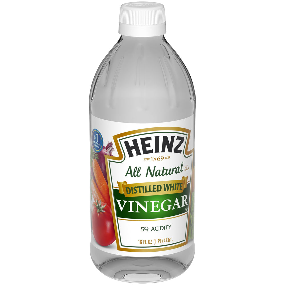 Close-up of clear HEINZ vinegar showing clean finish for dressings