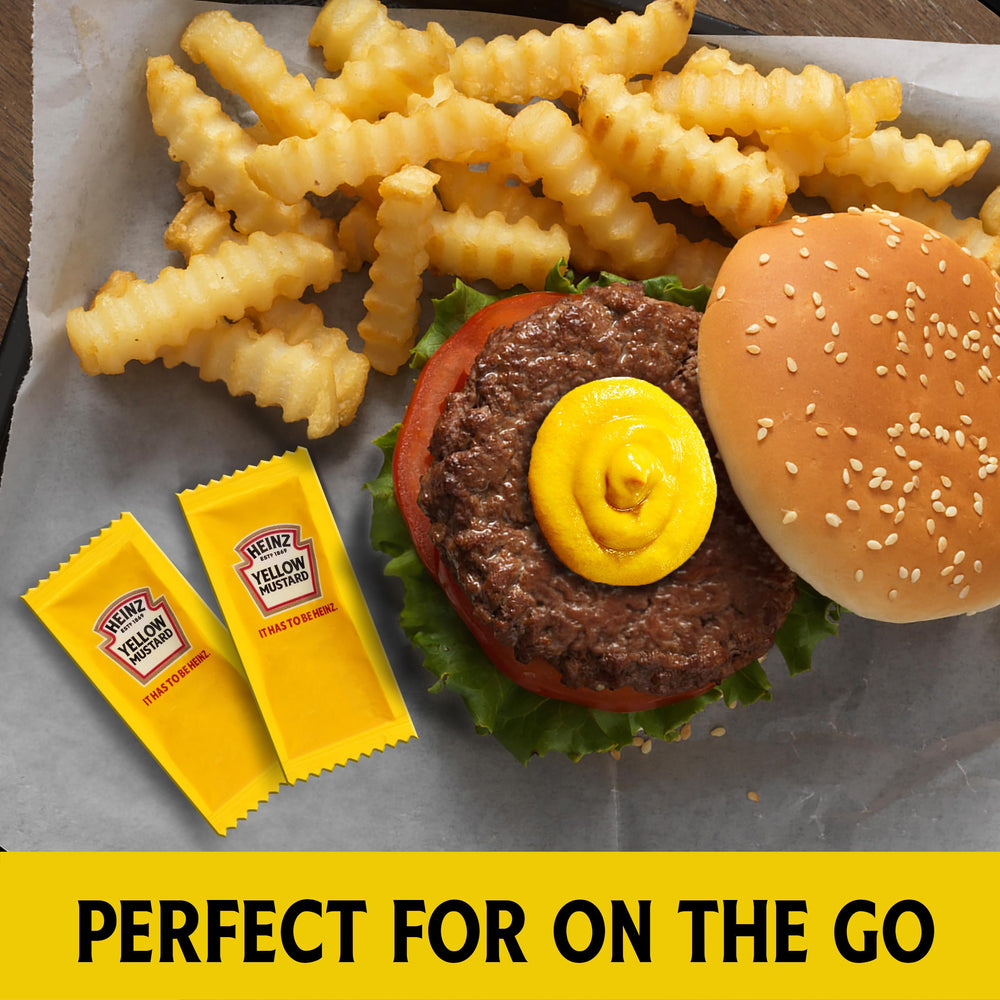 Heinz mustard packet on a deli sandwich for a tangy flavor boost.