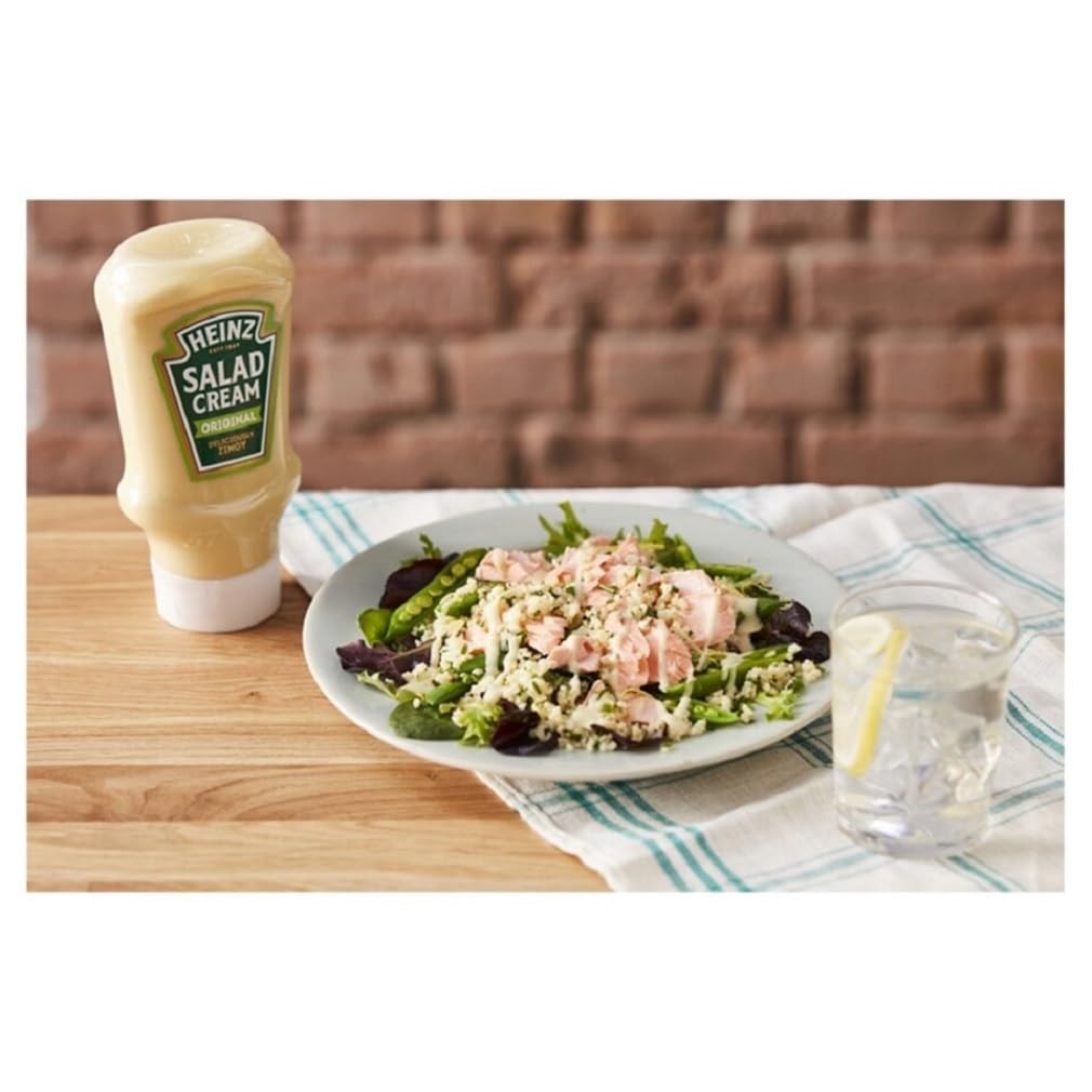 Heinz Salad Cream Original Squeezy over baked potatoes for versatile topping