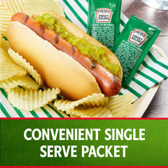 Hot dogs at a grill with Heinz Relish 9 g packet.