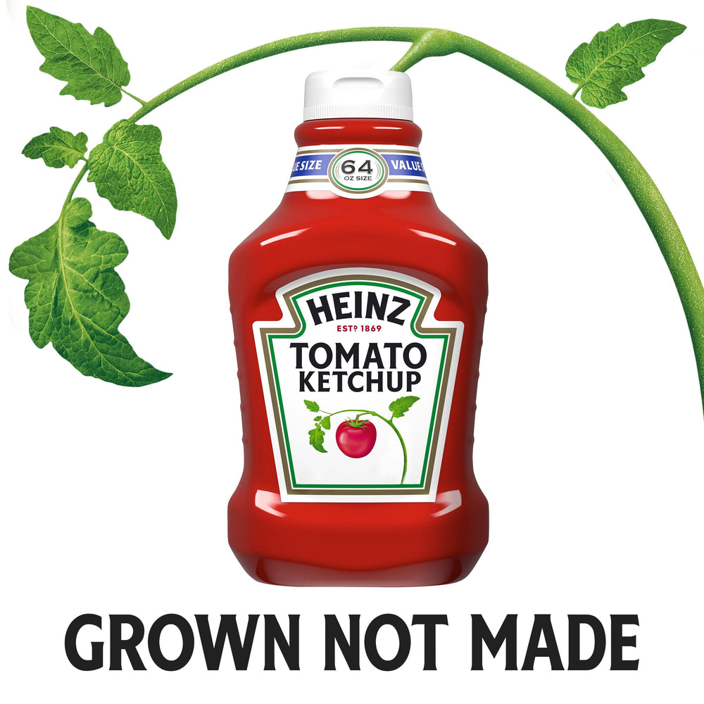 Heinz Tomato Ketchup 64oz bottle on hot dogs at a backyard barbecues.