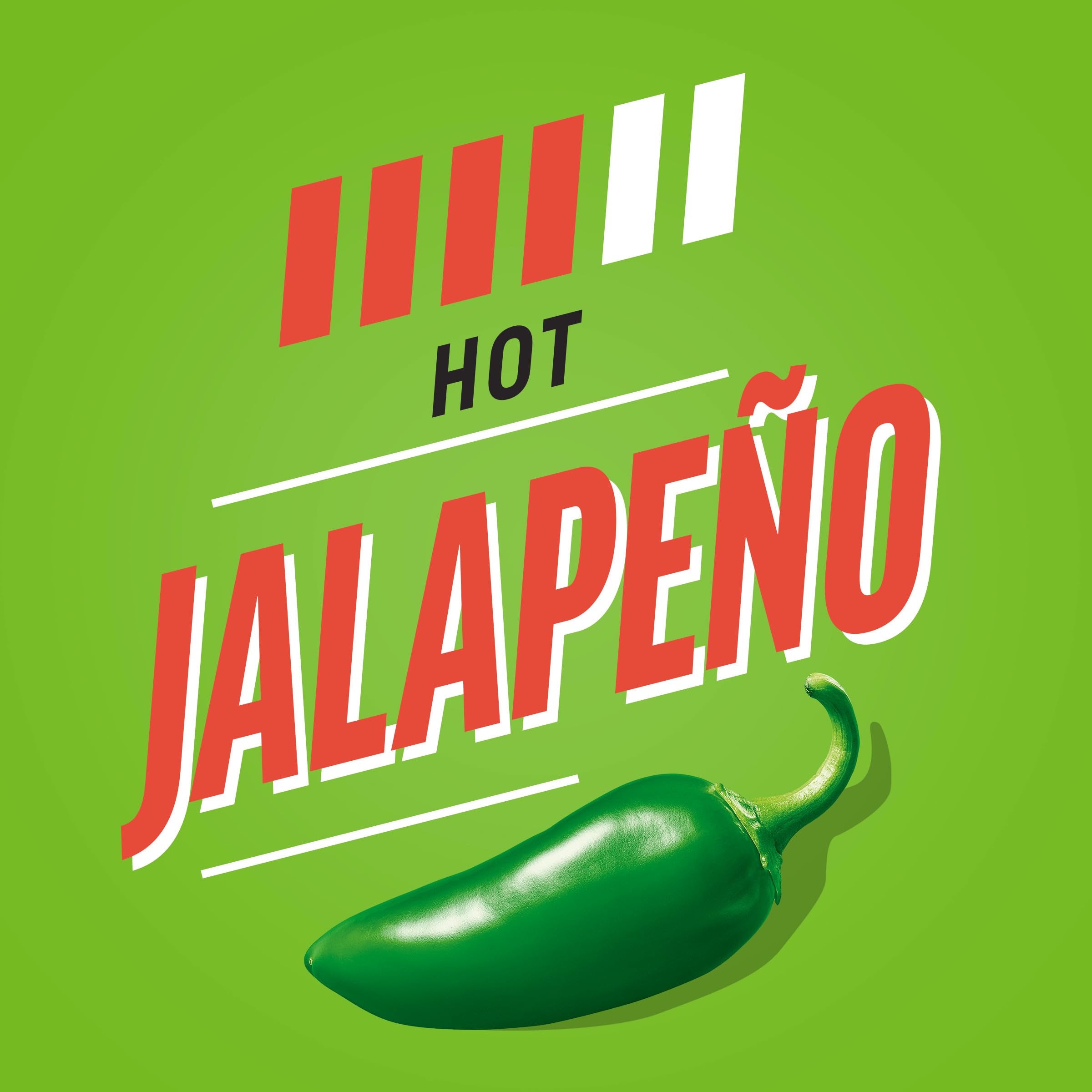 Heinz Jalapeño Ketchup beside chicken nuggets and fries for dipping flavor.