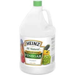 Heinz vinegar being poured over salad to balance flavors naturally