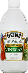 Pour shot of Heinz white vinegar ideal for brightening marinades and sauces.