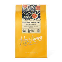 Heirloom Sugar Phoenix Blend bag closeup showing label and certification icons.