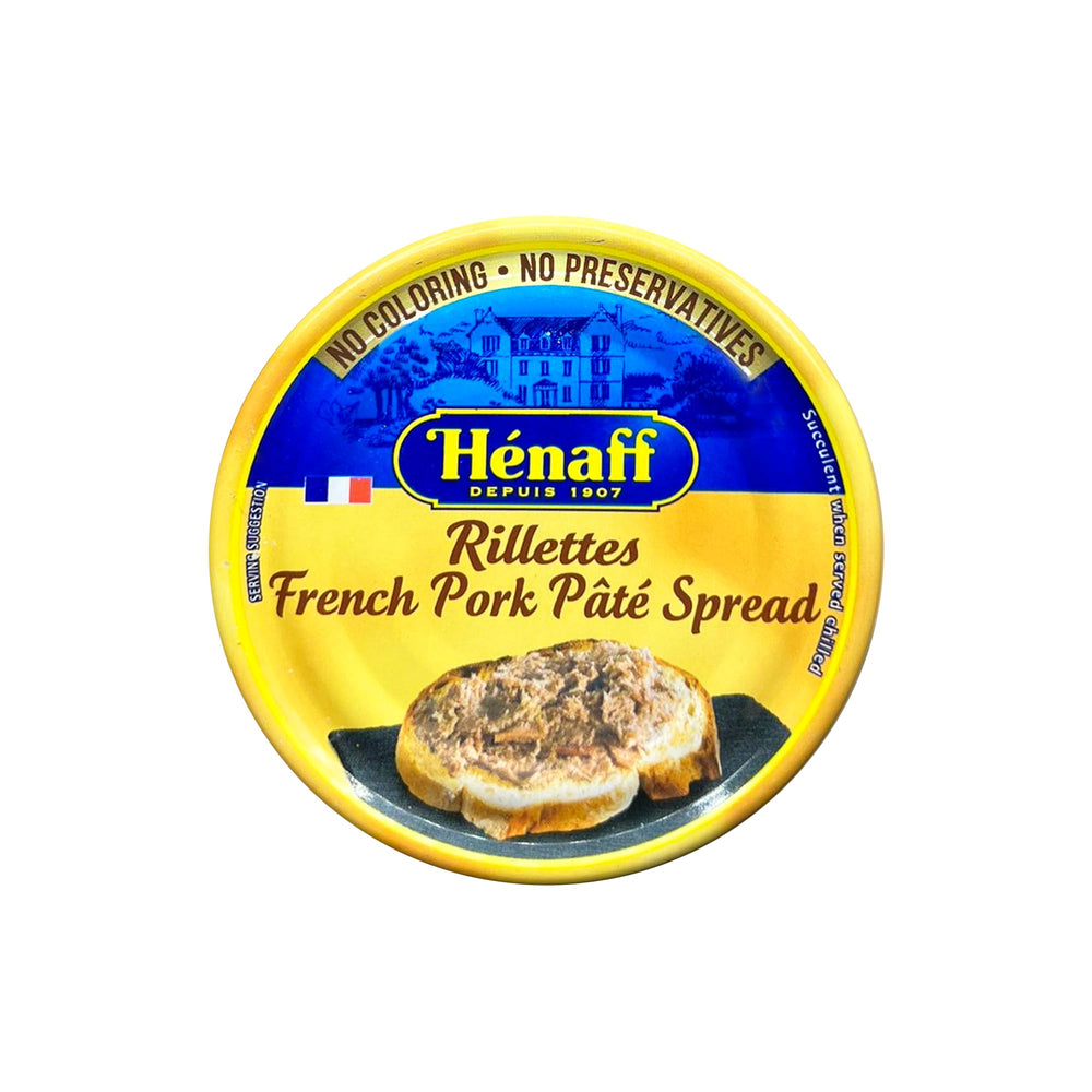 Hénaff pâté spread on a rustic charcuterie board