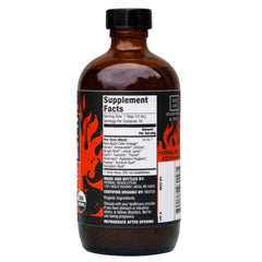 Close-up of Herbal Revolution Fire Cider ingredients showing horseradish and peppers