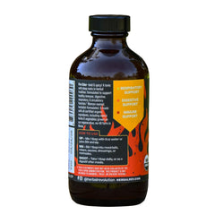 Herbal Revolution Fire Cider pour in a shot glass delivering spicy tang for recipes.