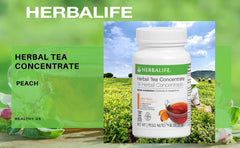 Dry Herbalife peach tea mix with a spoon beside the cup.
