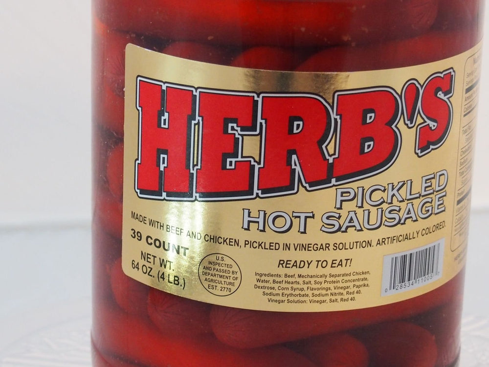 Herbs red hot pickled sausage slices close-up showing tangy crunch.