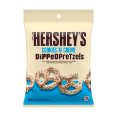 Hershey's Cookies 'n' Cream dipped Pretzels close-up show creamy dip and crunchy bite for a tasty snack.