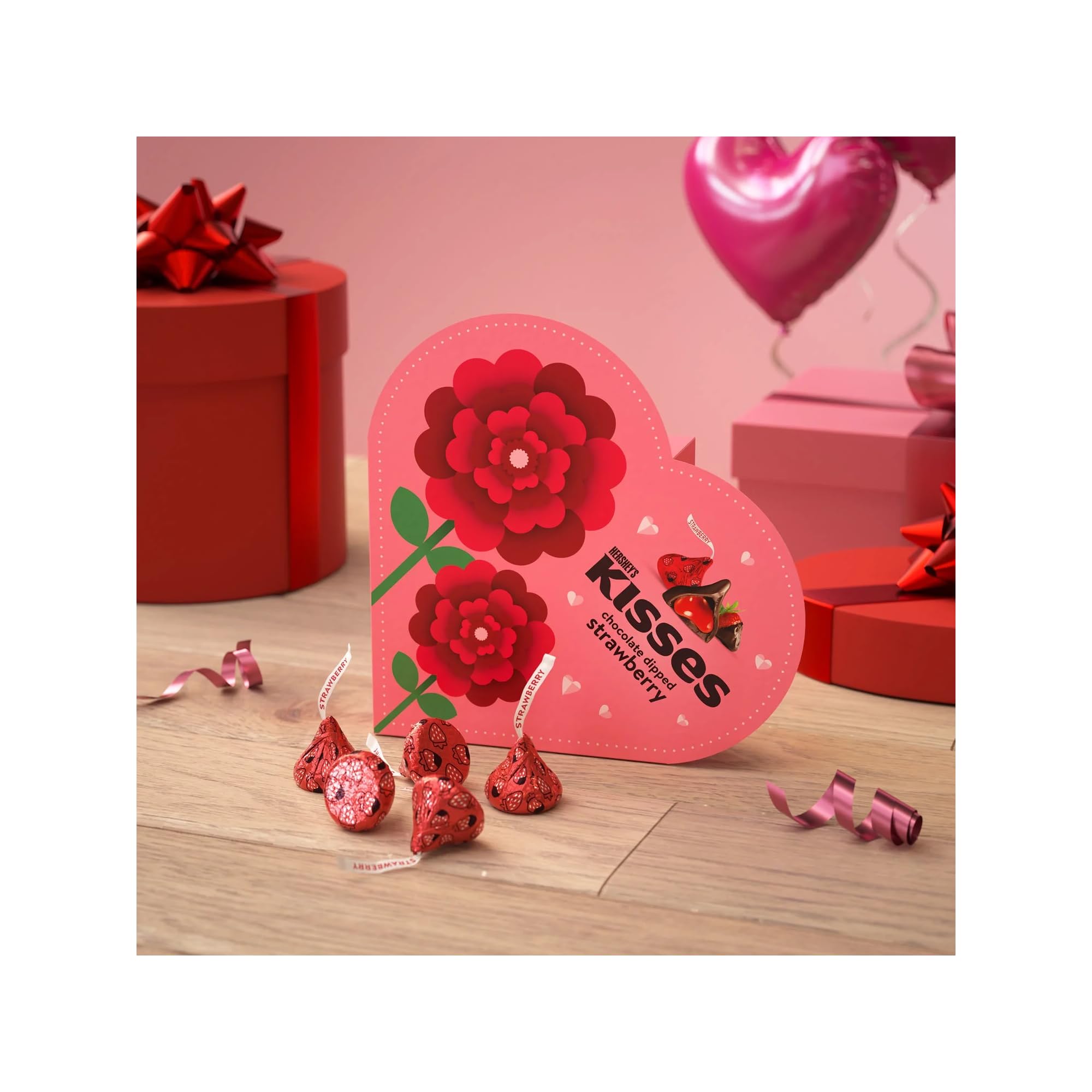 Hershey's Kisses heart box opening reveals festive foils for gifting.