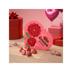 Hershey's Kisses heart box opening reveals festive foils for gifting.