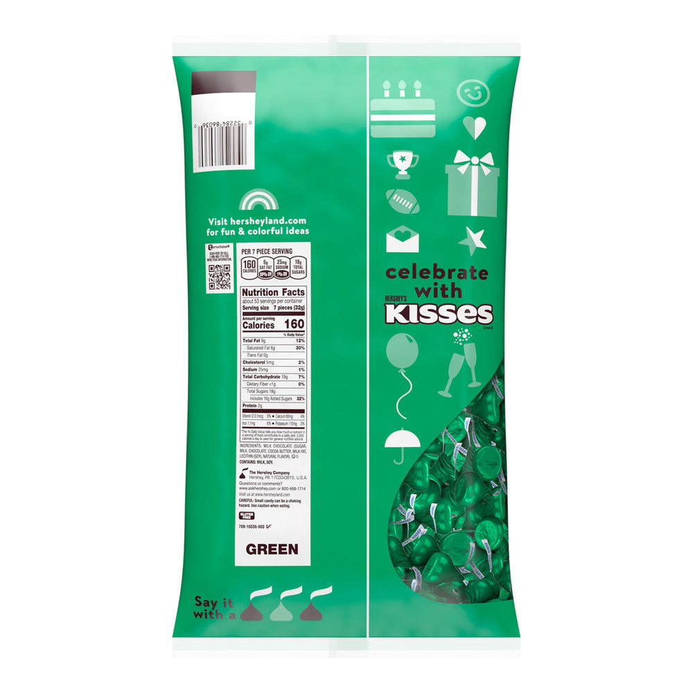 HERSHEY'S KISSES milk chocolate closeup with green foil wrap for celebrations.