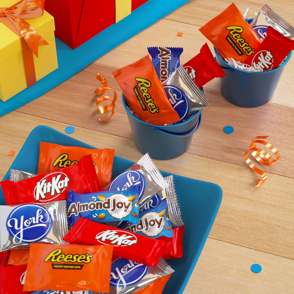 Hershey's Kit Kat wafers visible in a candy bar display, perfect for sharing at events