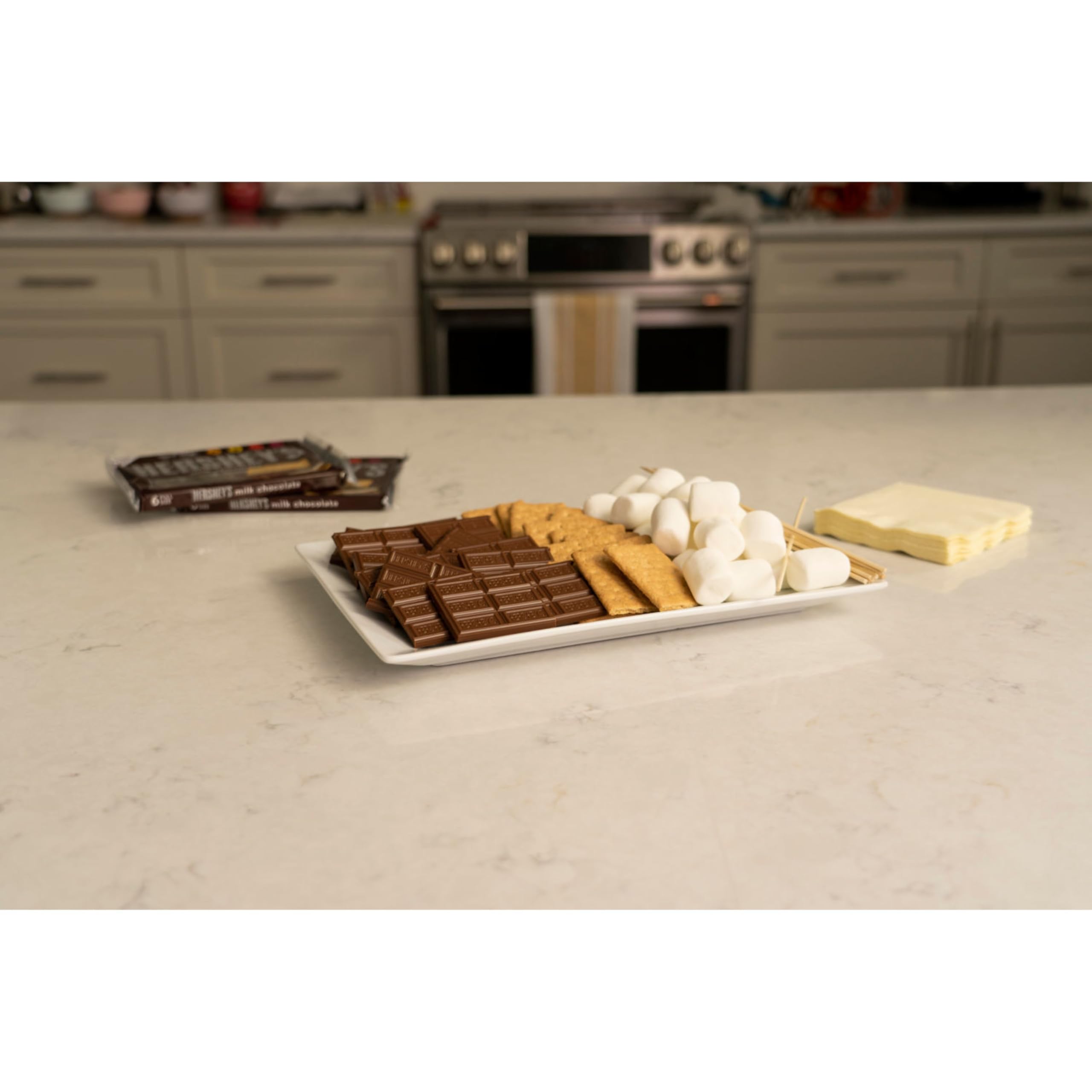 HERSHEY'S S'mores Kit Box camping scene evokes shared memories around a fire.