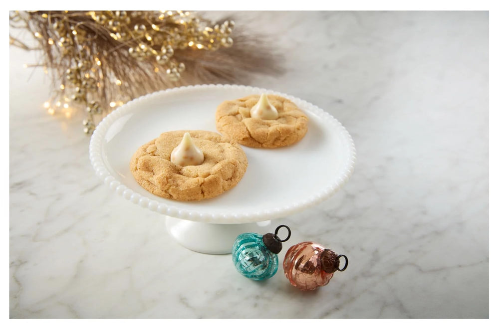 Hershey's Snickerdoodle Kisses on a candy dish, inviting guests to sample a cozy treat.