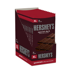 Friends enjoy HERSHEY'S SPECIAL DARK XL bars during movie night.