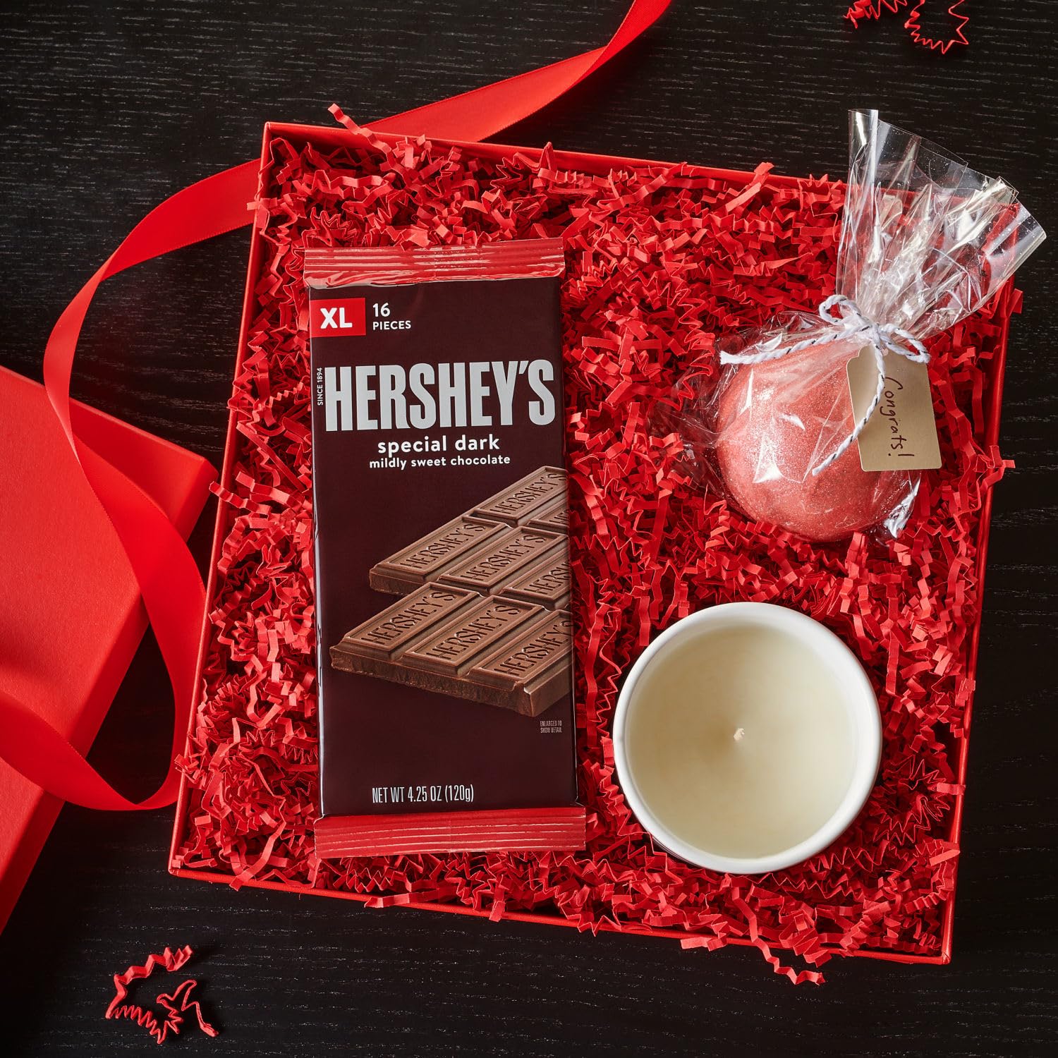 S'mores setup with HERSHEY'S SPECIAL DARK XL bars outdoors.