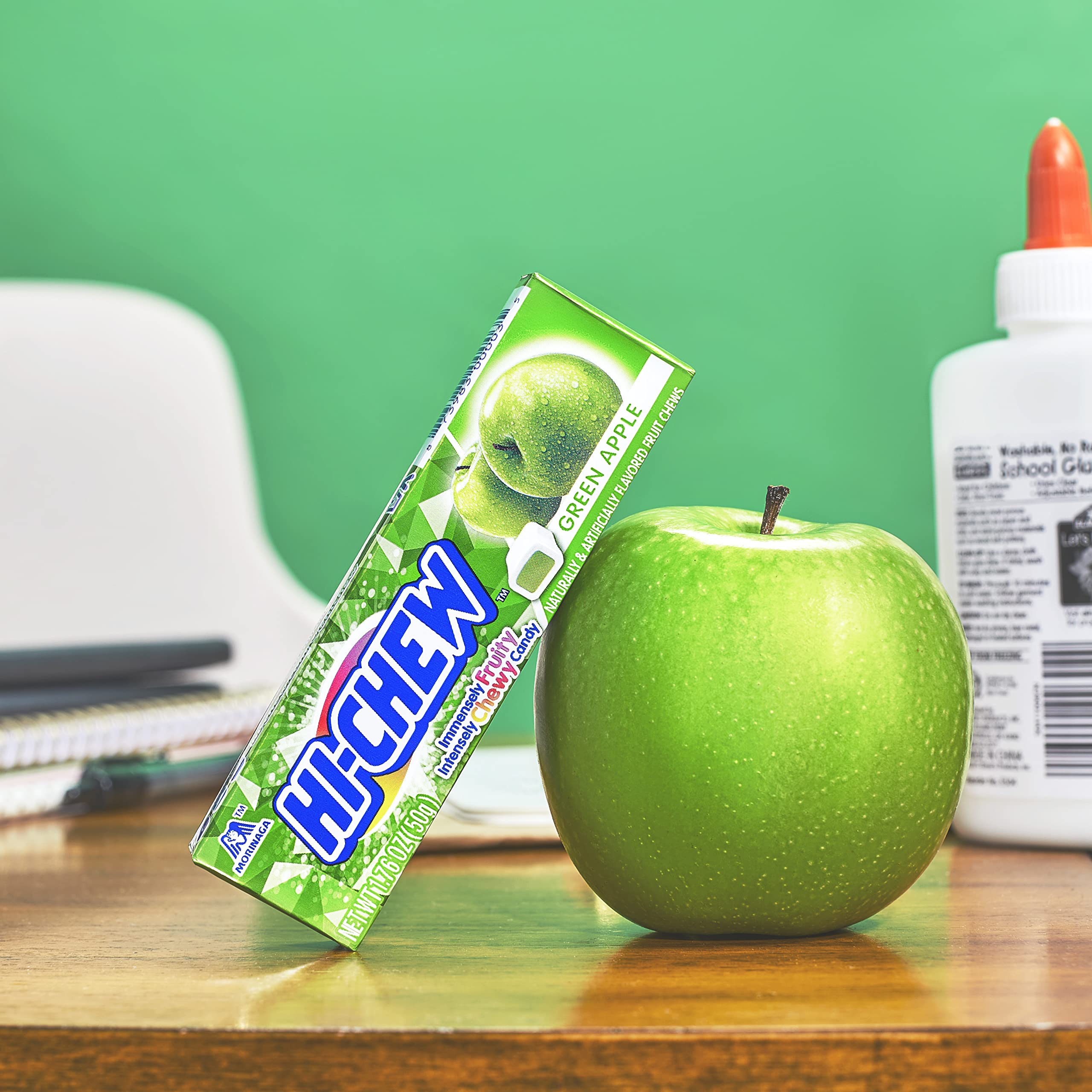 HI-CHEW Green Apple Sticks on desk, perfect quick treat between tasks.