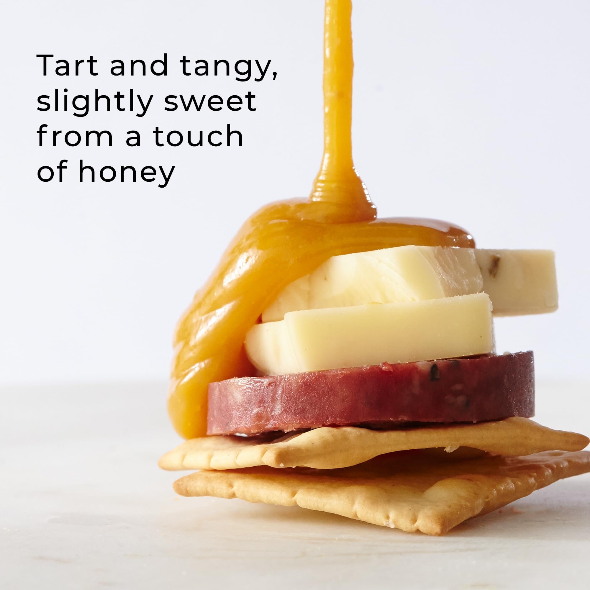 Hickory Farms Honey Pineapple Mustard on a charcuterie spread with meats and cheeses