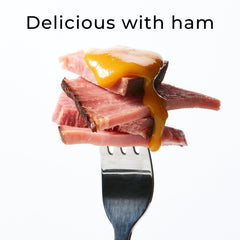 Hickory Farms Honey Pineapple Mustard spread on a sandwich for flavor boost