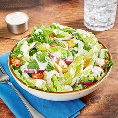 Hidden Valley Ranch dipping cup open with dressing ready to pour.