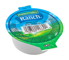 Hidden Valley Ranch dipping cups beside fresh vegetables for dipping.