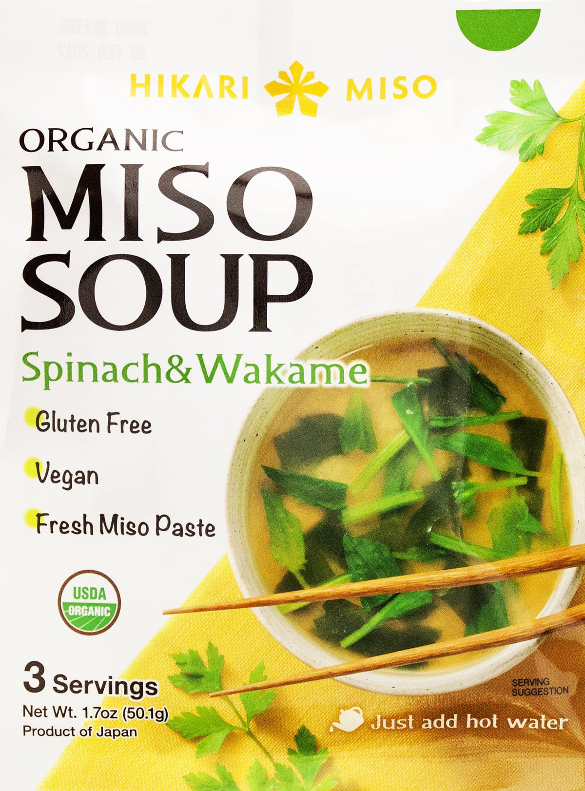 Hikari Miso Organic Instant Miso Soup with spinach and wakame in a bowl.