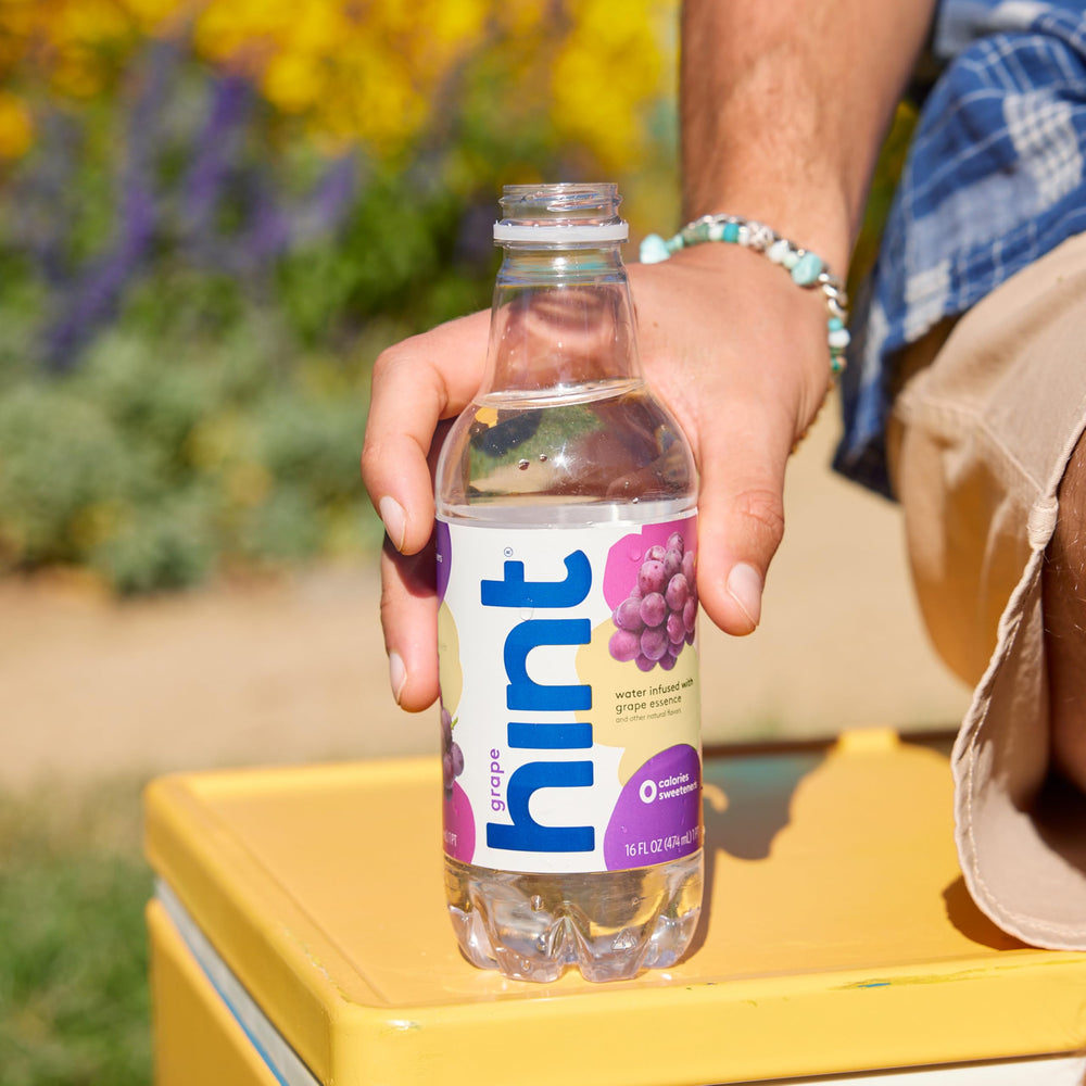 Hint Grape bottle in hand for quick, delicious refreshment.