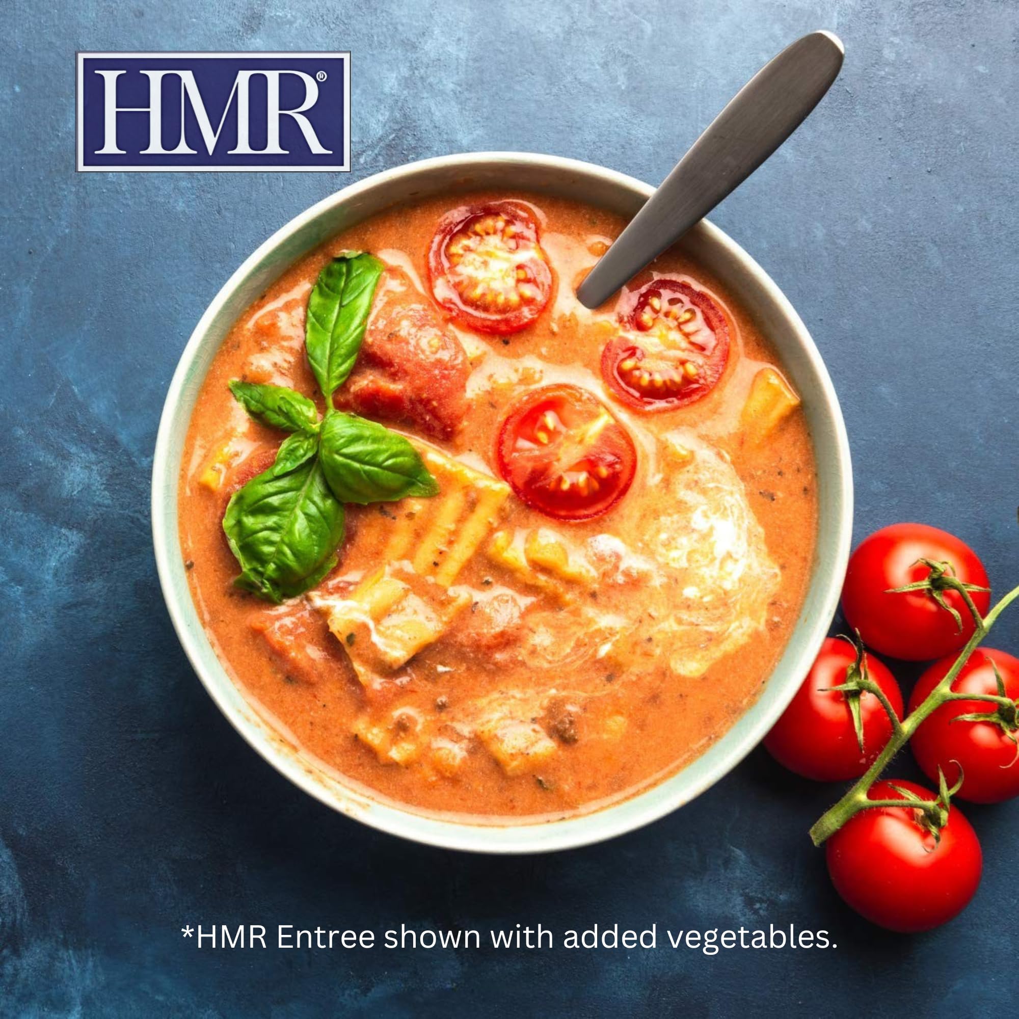 HMR Lasagna with meat sauce, serving on plate with greens or salad.