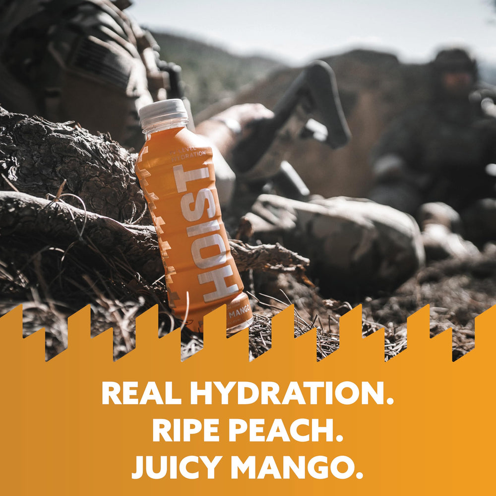 HOIST Peach Mango flavor bottle closeup highlights natural taste without artificial additives.