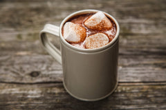 Hollander Chocolate mocha drink pour illustrates versatile mixable powder for café-style beverages