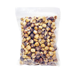 Close-up of Holmquist Hazelnuts showing glossy roasted texture for snacking.