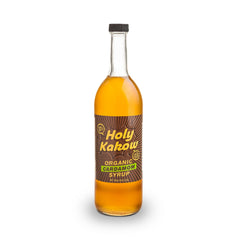 Holy Kakow Cardamom Syrup bottle on table for rich coffee flavor
