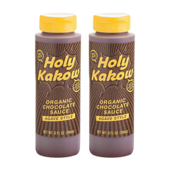 Holy Kakow Organic Chocolate Sauce bottle pouring over dessert for rich, gluten-free indulgence