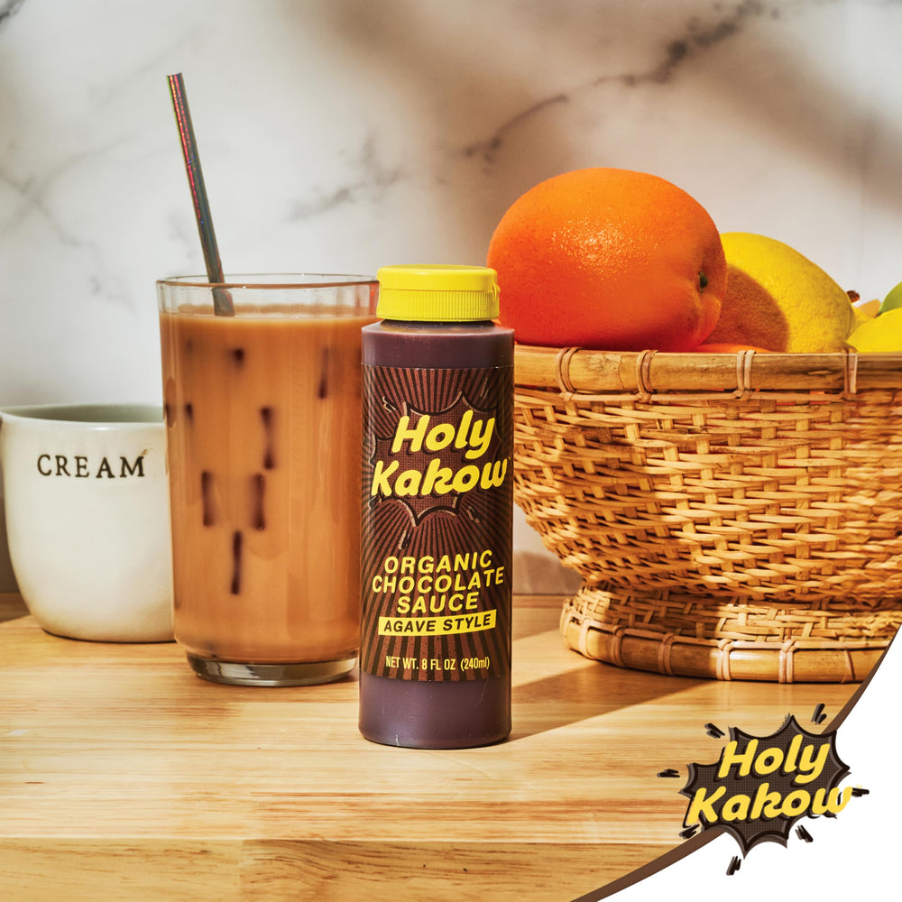 Display of Holy Kakow Organic Chocolate Sauce two-pack on a pantry shelf