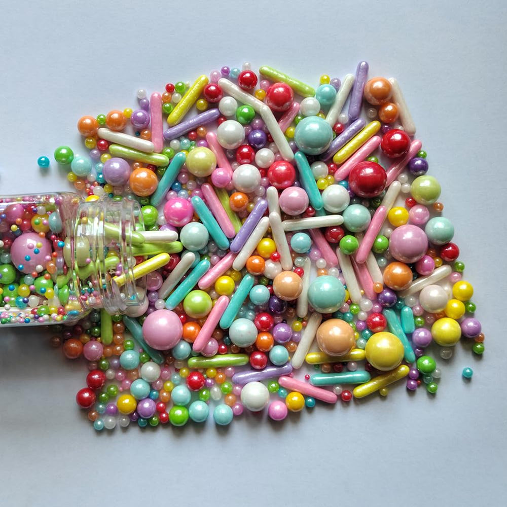 Homankit cupcake toppers with rainbow sprinkles brighten treats at parties.