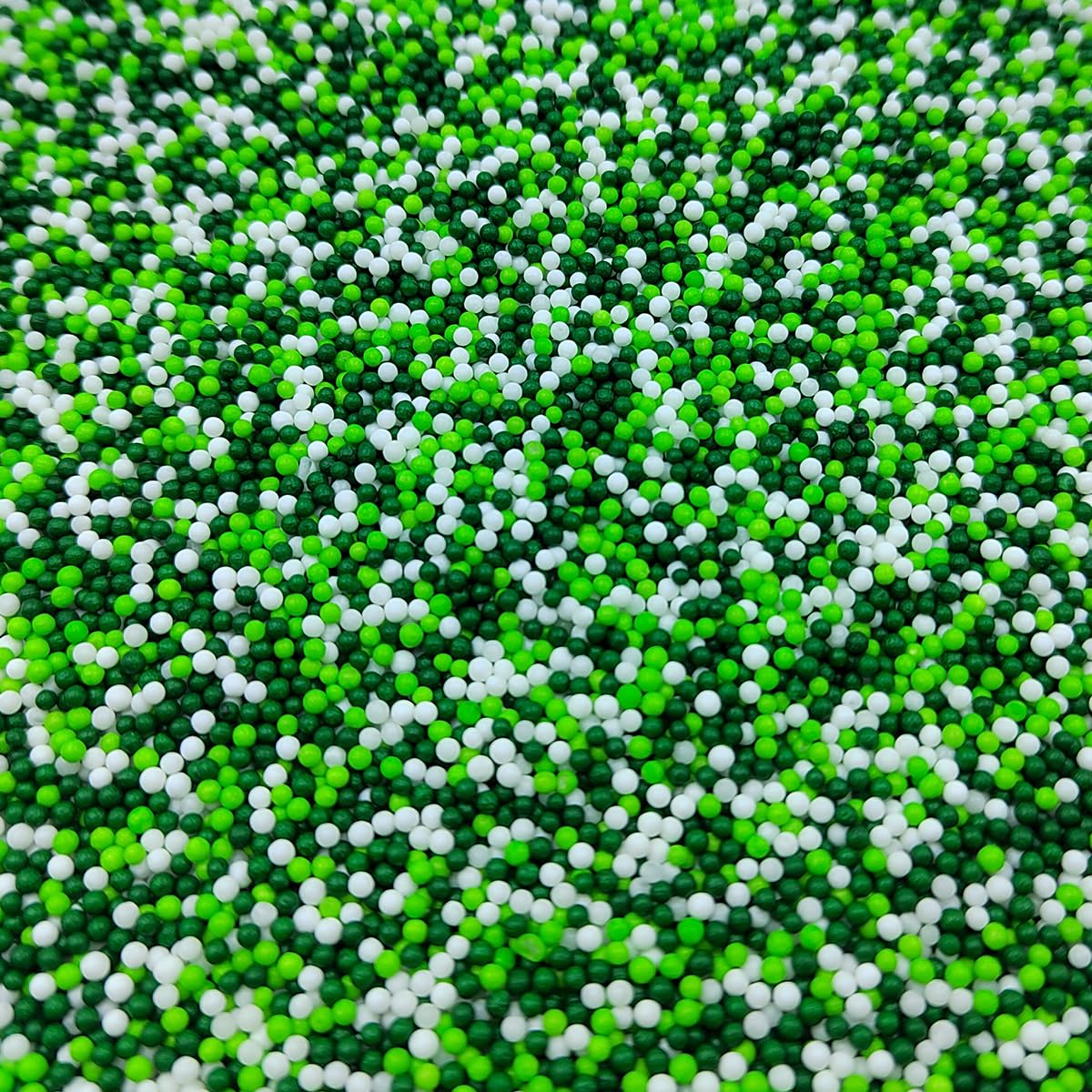 Homankit white and green nonpareils on cookies and cakes.