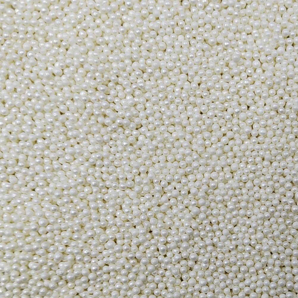 Homankit white nonpareil sprinkles bottle for even cake decorating and eye-catching toppings.
