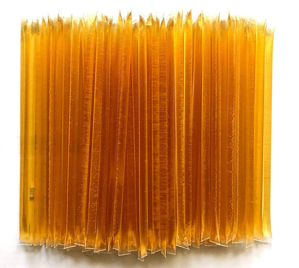 Bulk storage of Homestead Honey sticks kept neatly at home.