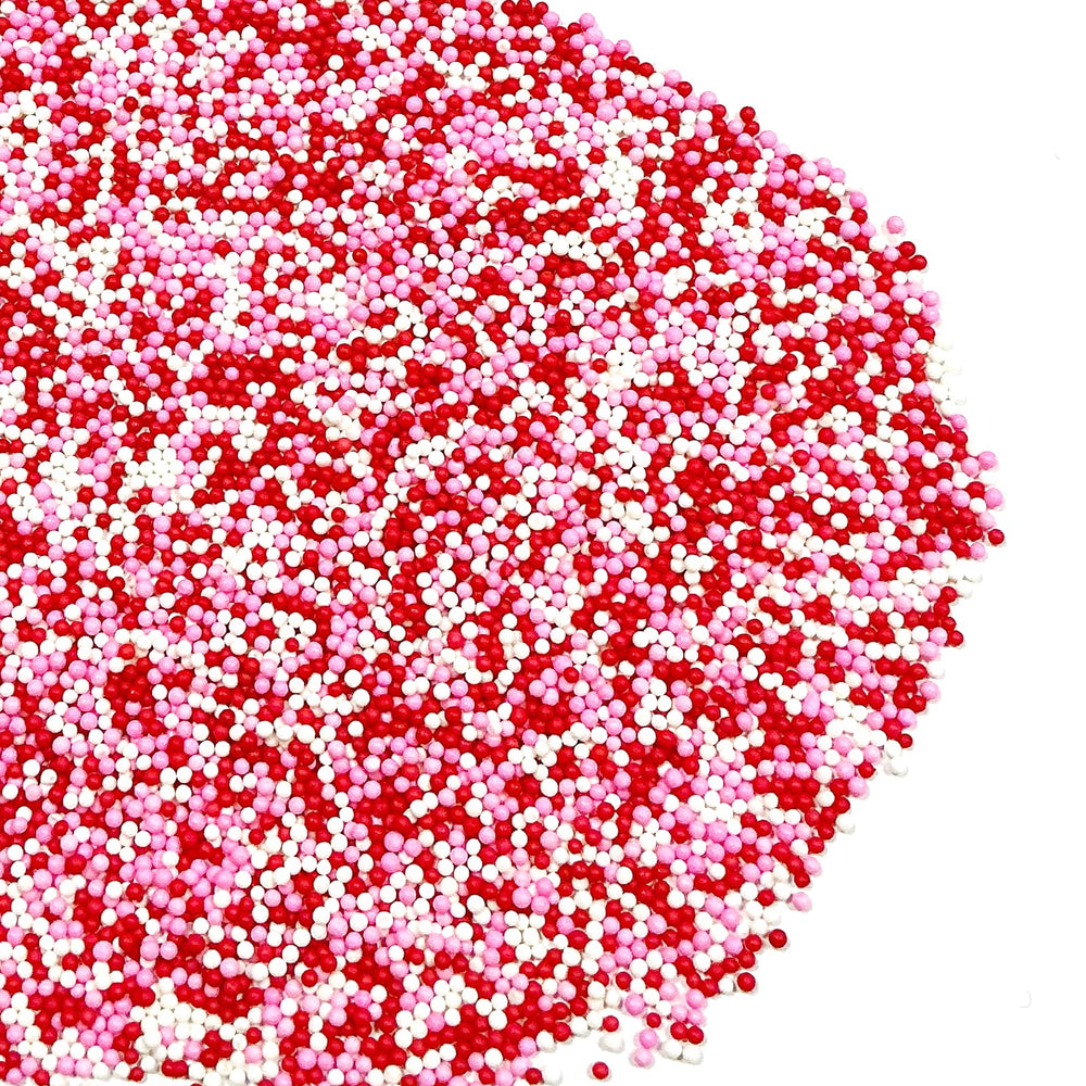 Homipooty Valentine sprinkles closeup shows vibrant packaging and pearl finish.