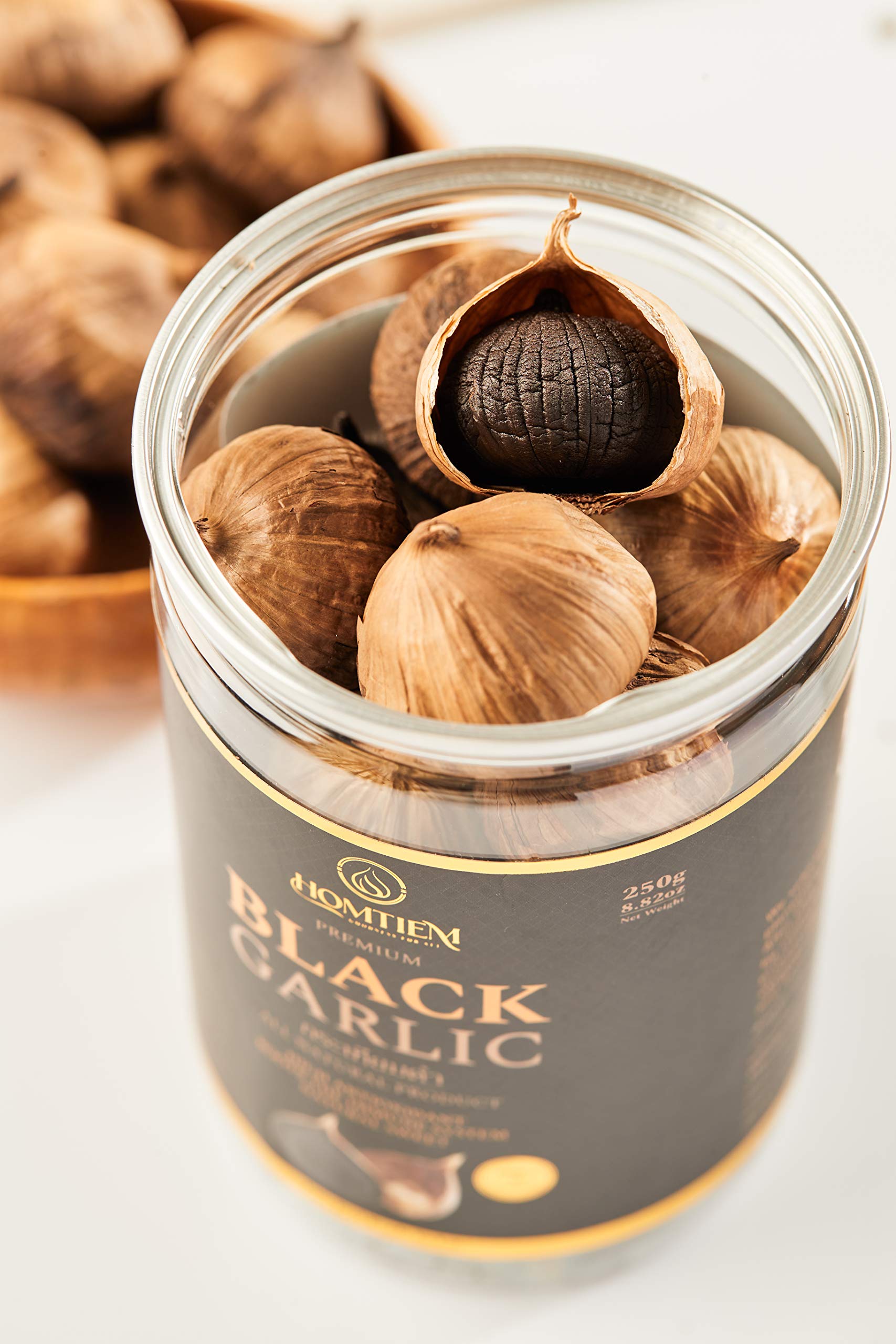 HOMTIEM Black Garlic jar pearl closeup, jelly-like texture ideal for snacks.