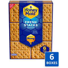 Honey Maid graham crackers with marshmallows and chocolate, ideal for s'mores at home.