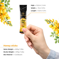 HONIGMA Acacia honey sticks in glass jar reveal light color.