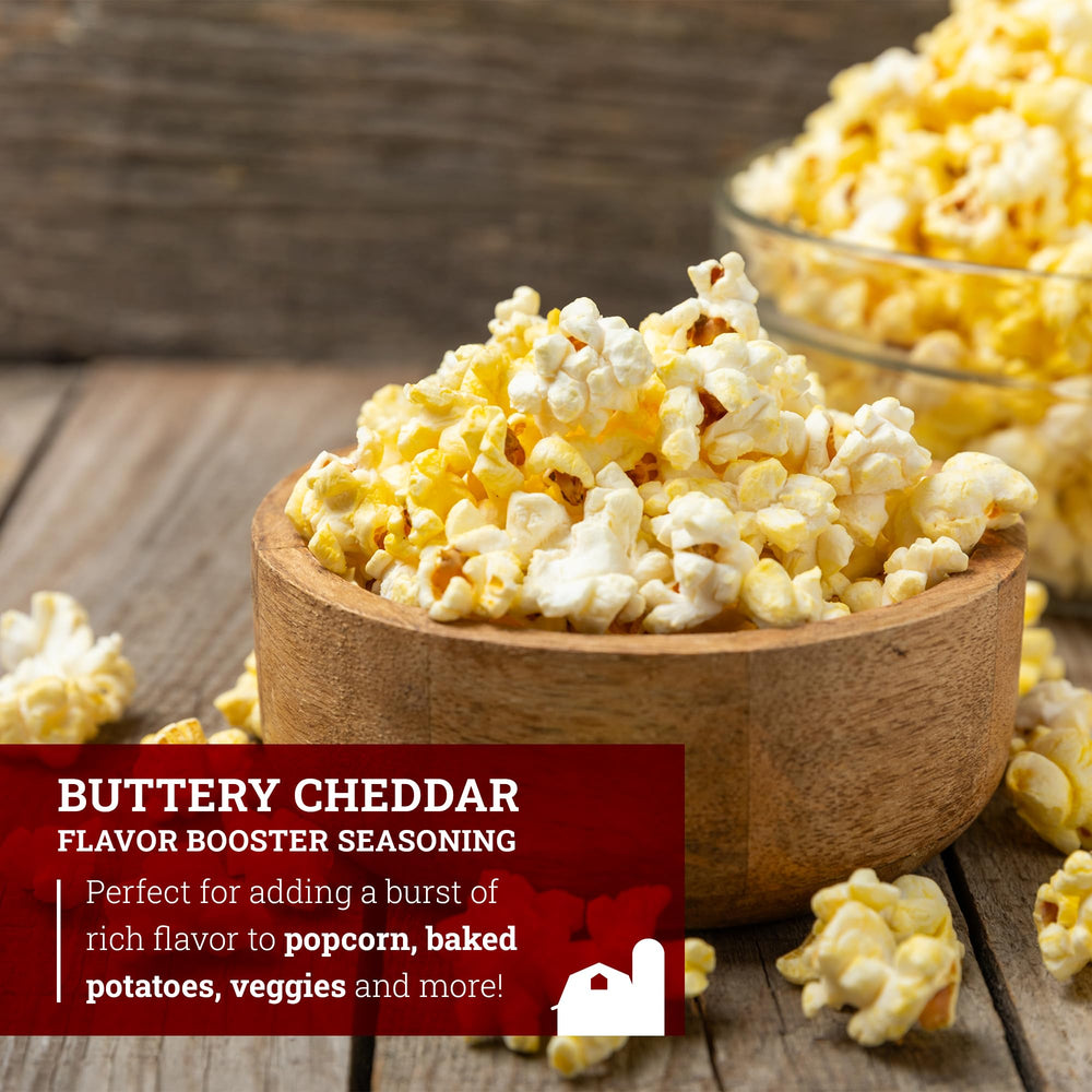 Hoosier Hill Farm seasoning poured over popcorn delivers rich cheddar