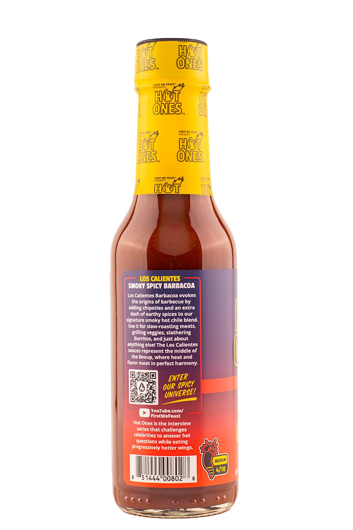Hot Ones Los Calientes being poured over ribs for a smoky, sweet-spicy glaze
