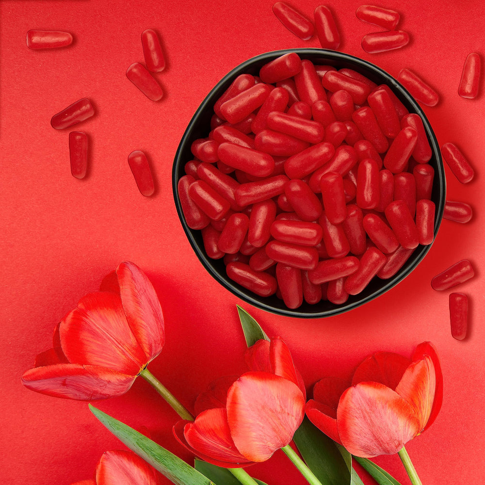 Hot Tamales Fierce Cinnamon candy on popcorn image demonstrates a movie-night flavor boost.